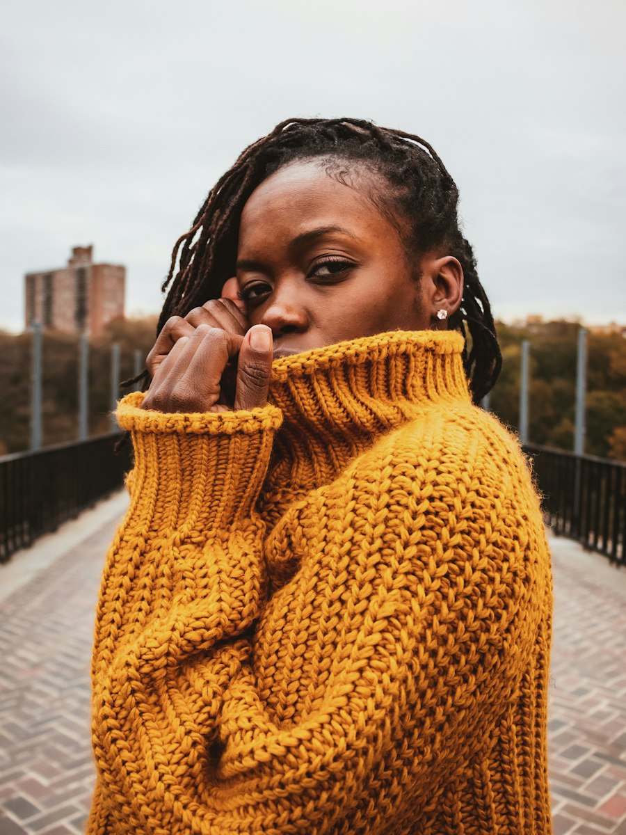 Chunky knit turtleneck against autumn trees